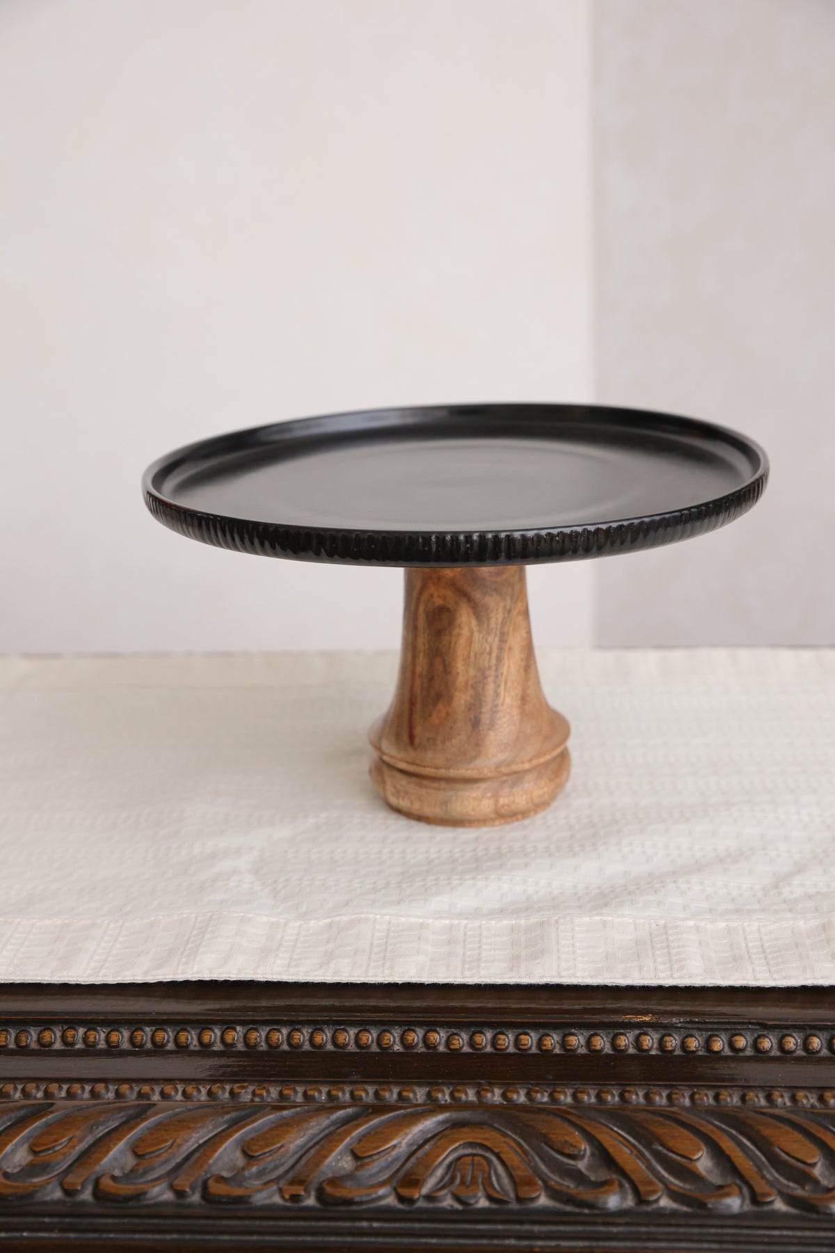 Black fringed ceramic and wood platter